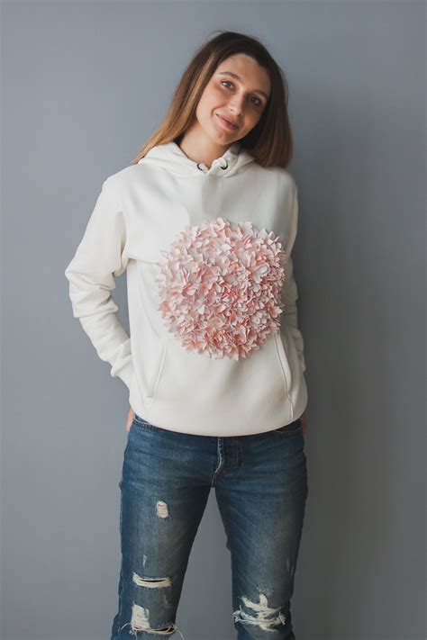 designer hoodie with white flowers.